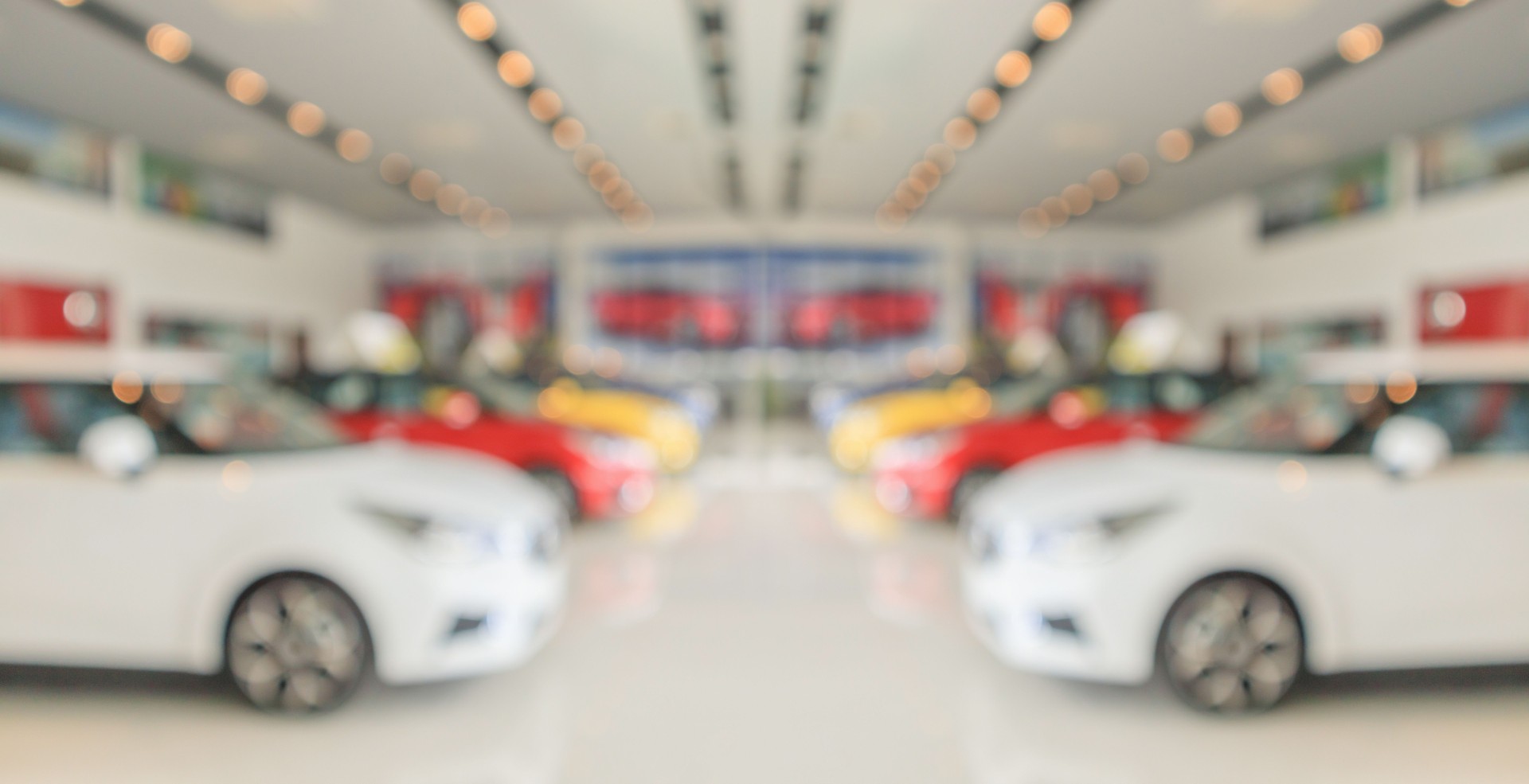 new cars in showroom interior blurred abstract background